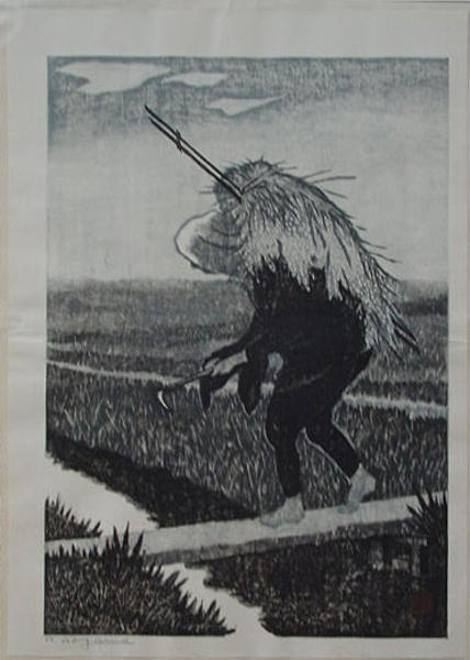 man cutting hay by hand