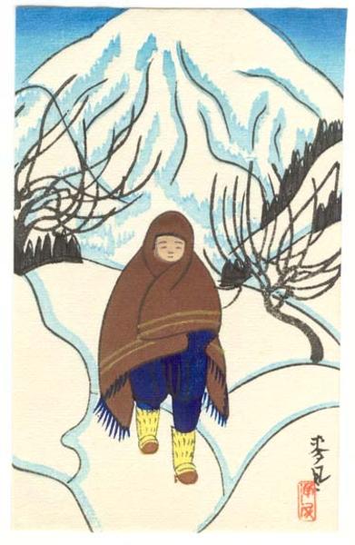 Child walking through snowy field