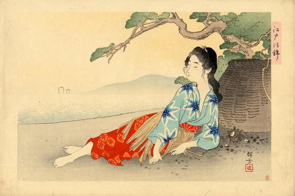  Woman diver relaxing on a beach