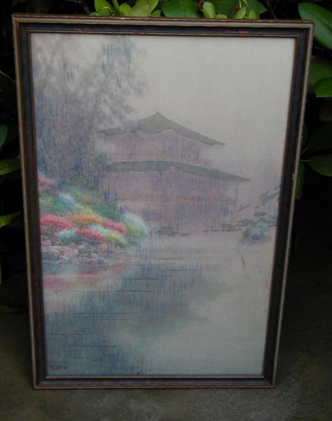Temple with mounds of mums on a riverbank