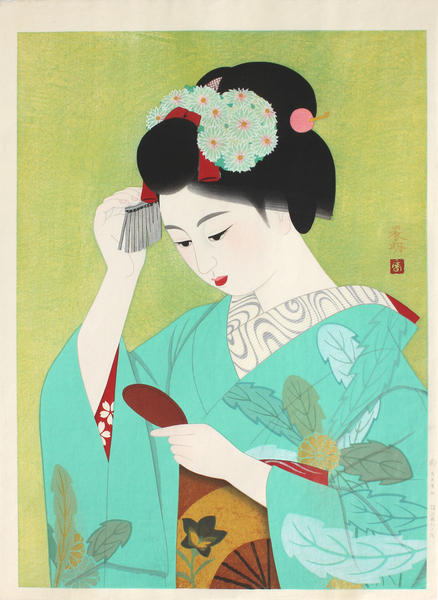 Young woman with hand-mirror