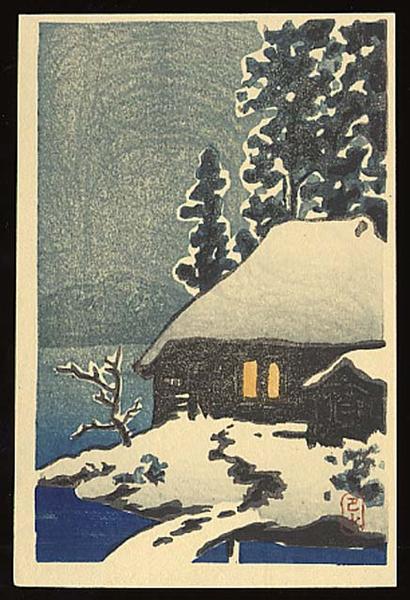 Evening View of a Snow Covered Cottage