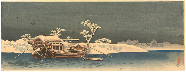 Boat by the snow-covered bank of the Sumida River