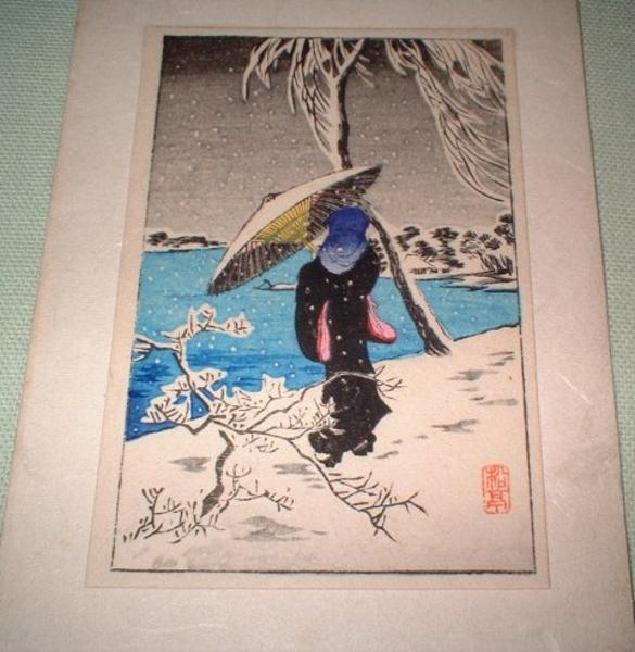 Woman in snow by the river
