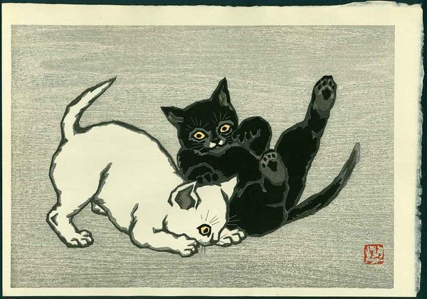Two cats playing