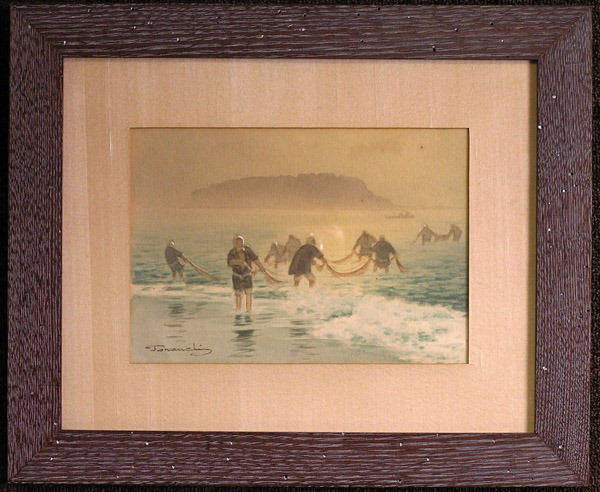 Fishermen with nets at the beach of Enoshima