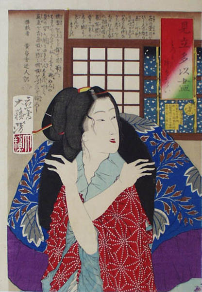 A young woman looking at the falling snow