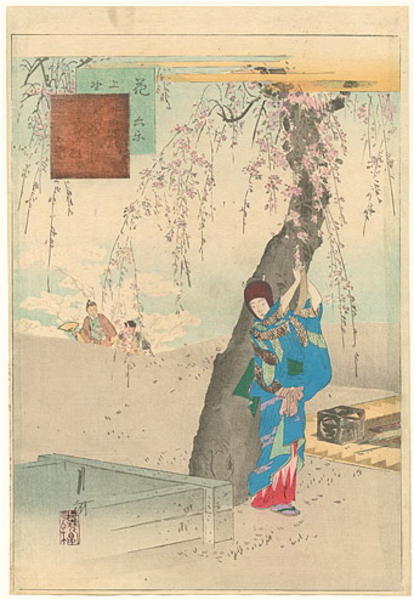 Woman tying a poem strip to a tree at Ueno