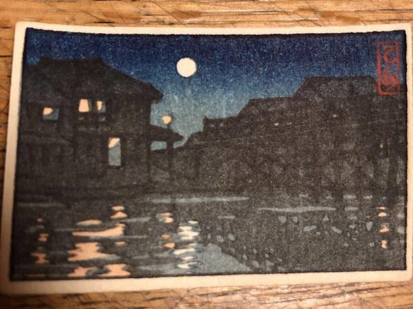 Night scene, town by river