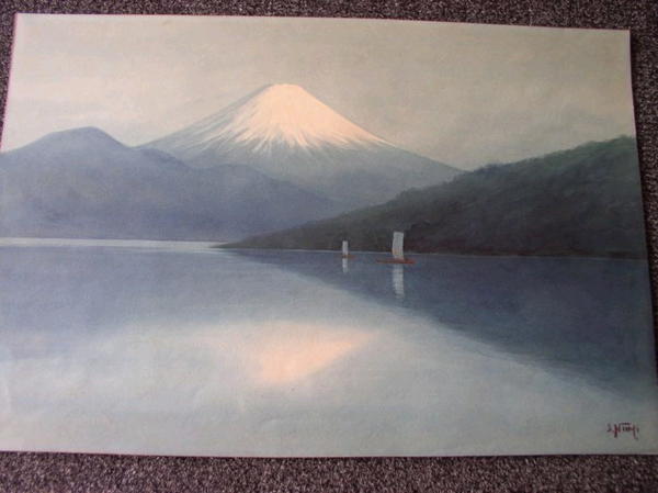 Sailing boats on lake by Mt Fuji